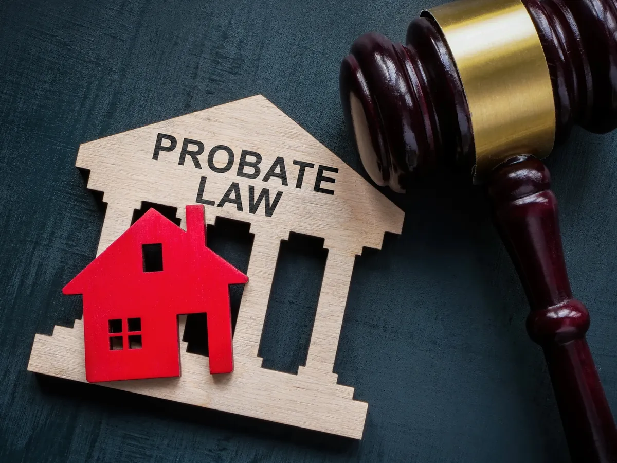 Probate law with gavel and home cut outs