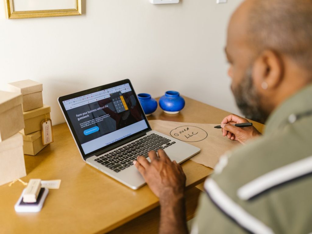 Entrepreneur at a desk using a laptop for business planning