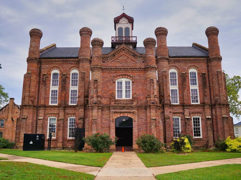 Historic red brick county courthouse with a clock tower