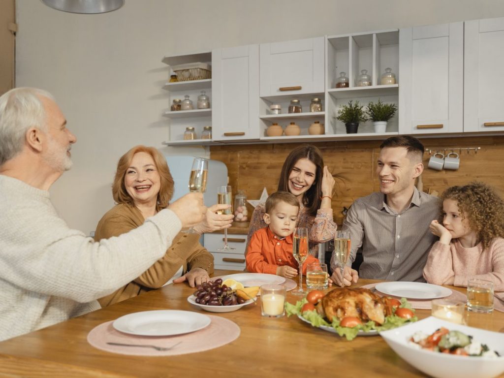 A joyful family gathering at home, celebrating Thanksgiving with food and smiles