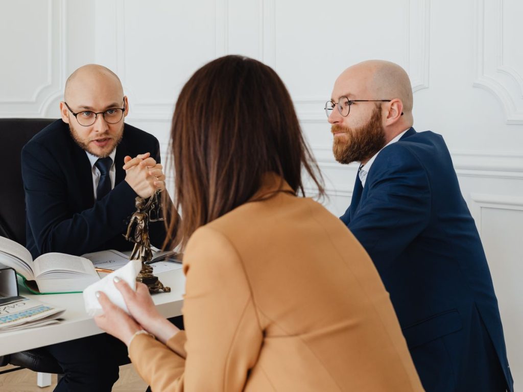 Professional discussion among lawyers in a modern office, focusing on legal matters