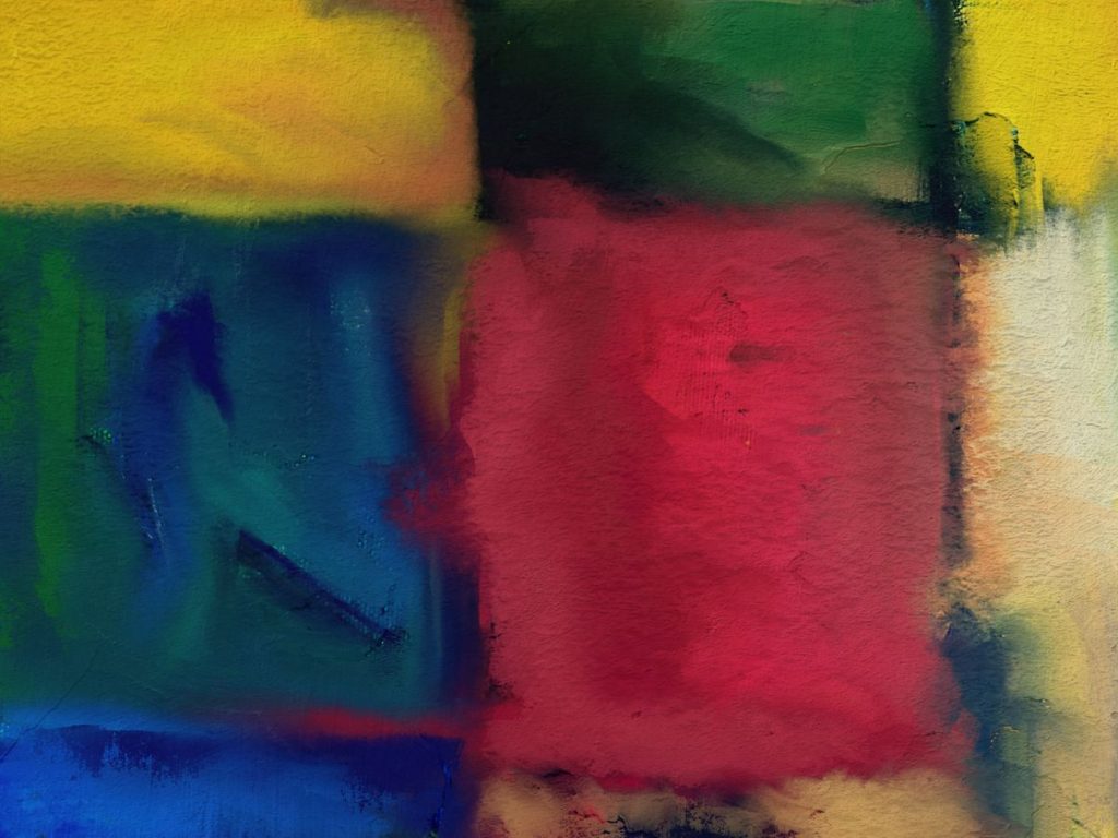 A vibrant abstract artwork with red, yellow, green, blue blocks creating a colorful canvas