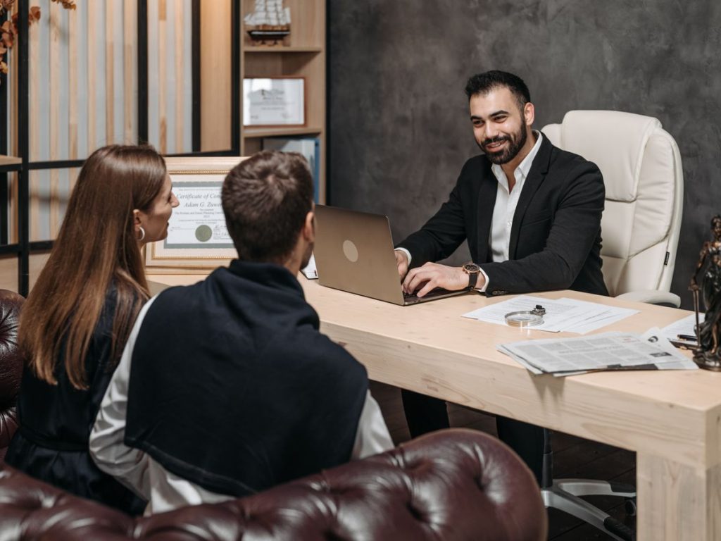 A professional meeting with a lawyer consulting clients in an upscale office environment